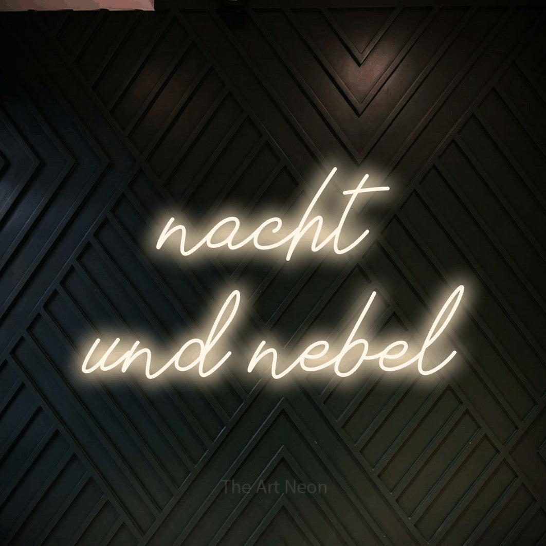 LED neon sign reading “nacht und nebel”, arranged in 2 lines.