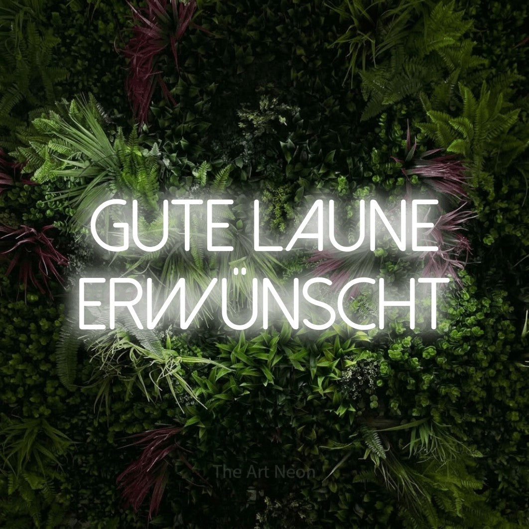 LED neon sign displaying “gute laune erwünscht”.