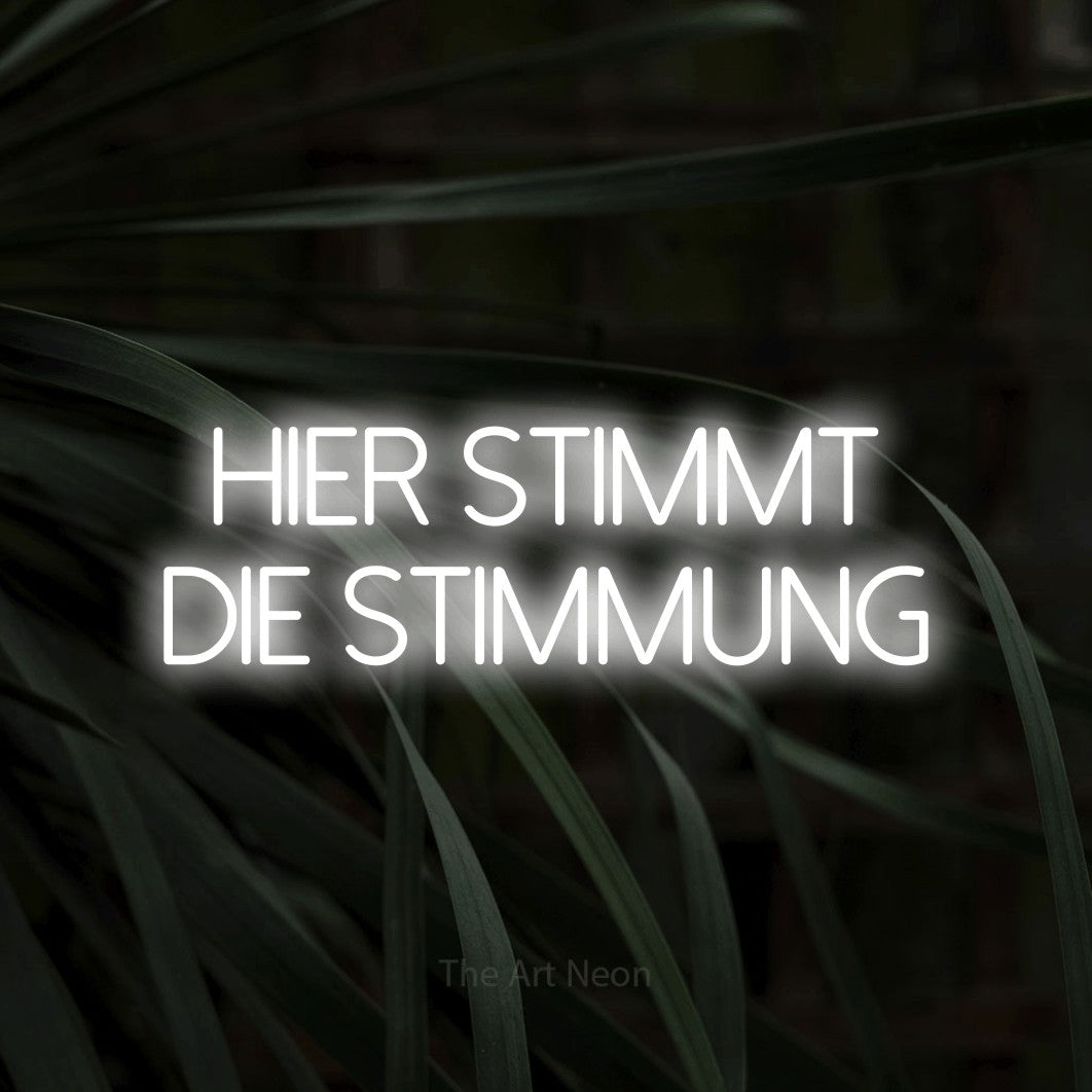 LED neon sign reading “Hier stimmt die Stimmung”, arranged in 2 lines.