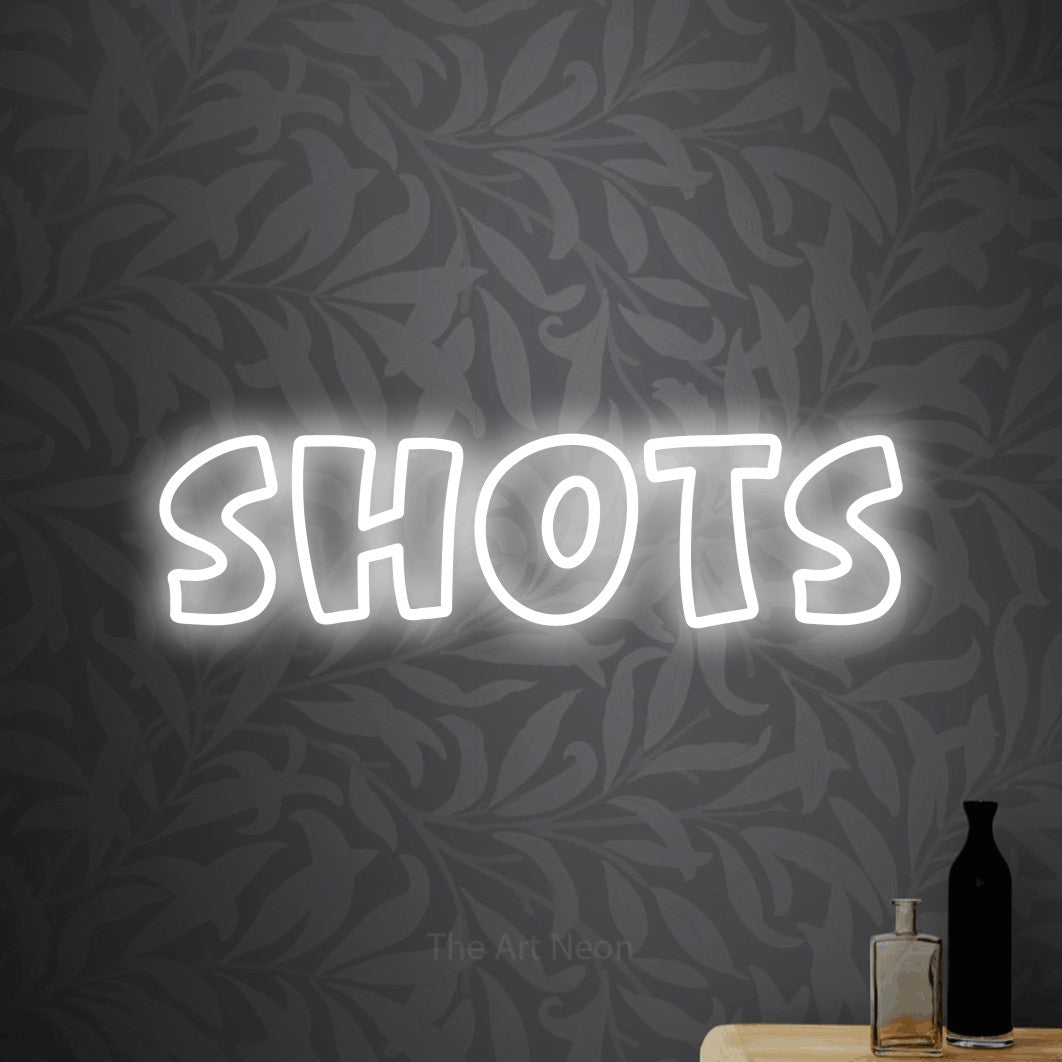 LED neon sign reading “Shots”, arranged in a single line.