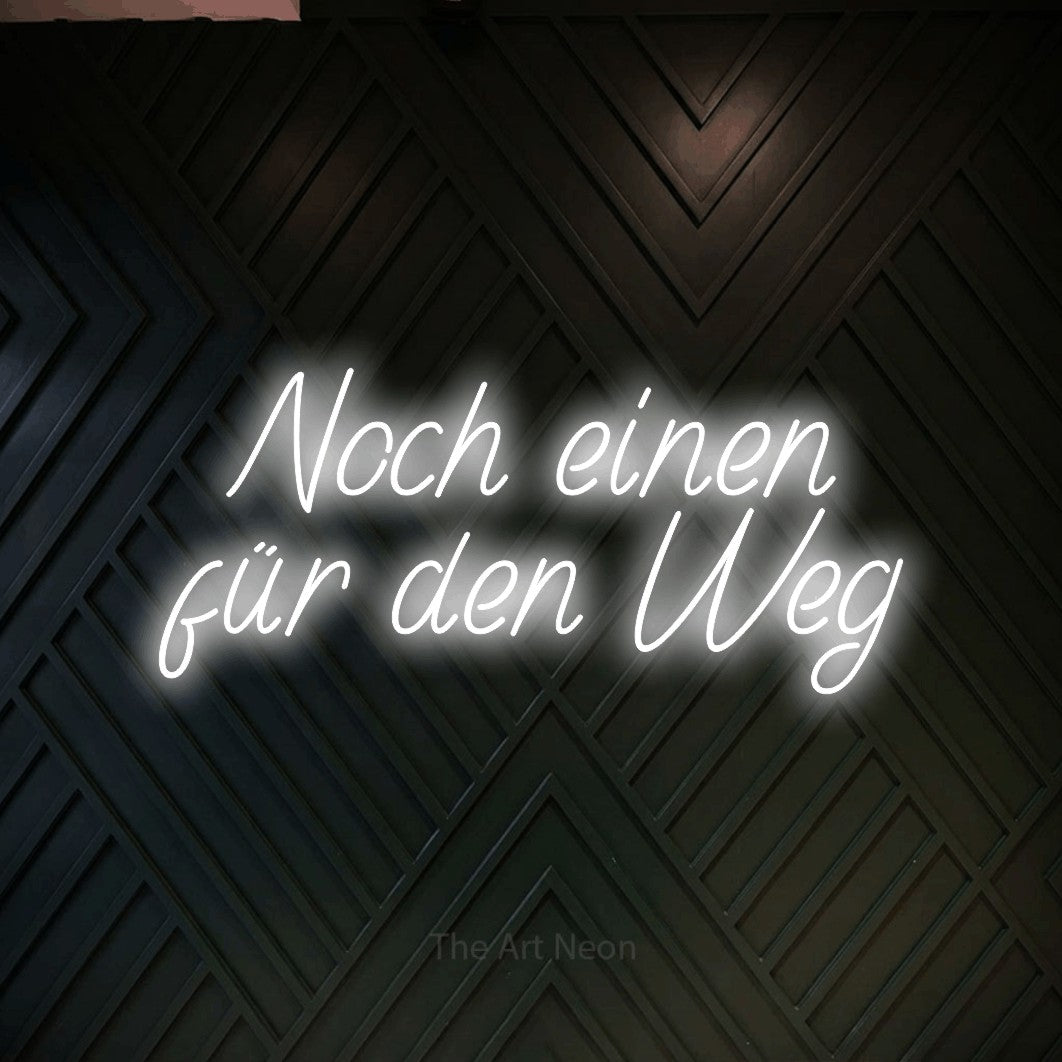 LED neon sign displaying “Noch einen für den Weg”.