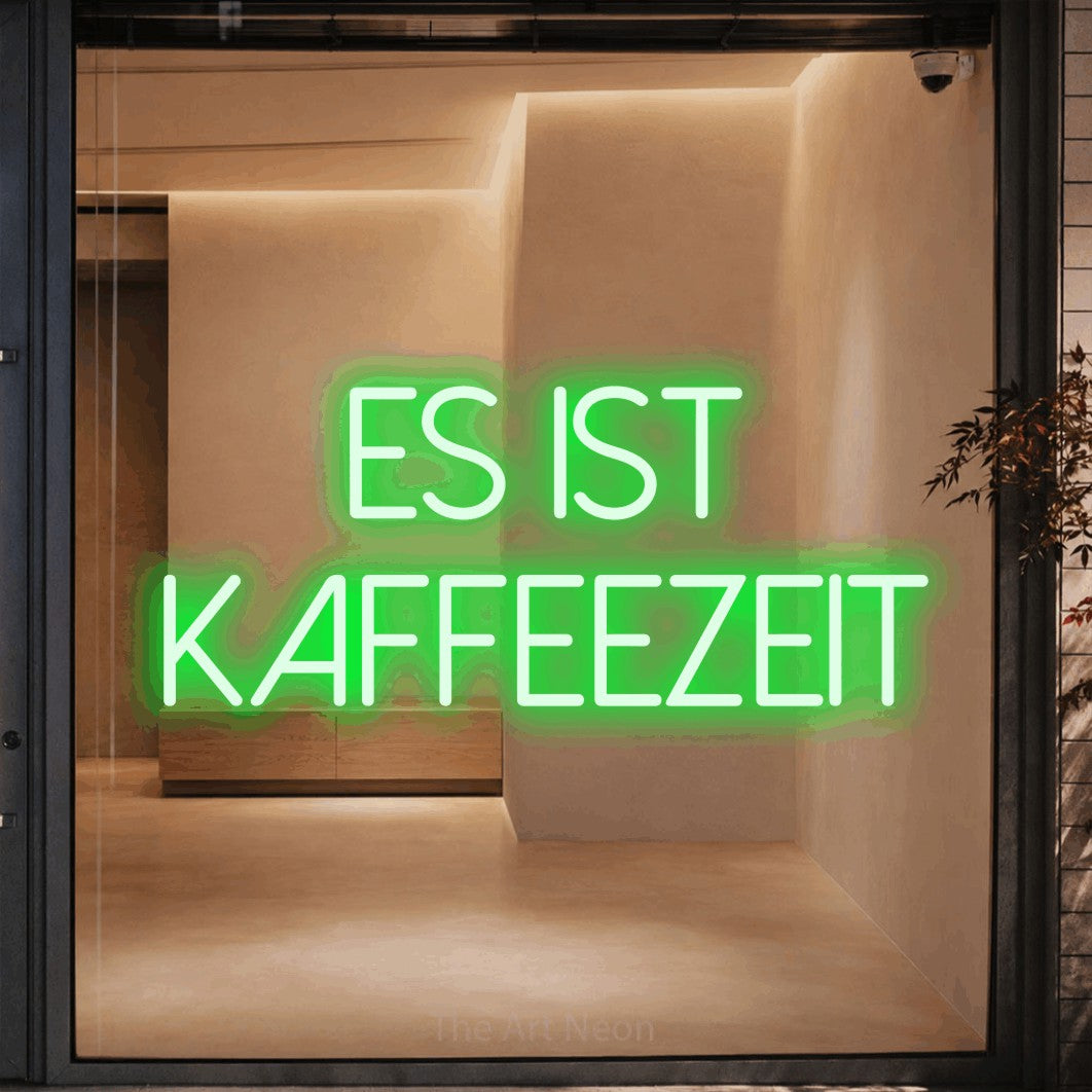 LED neon sign reading “es ist kaffeezeit”, arranged in 2 lines.