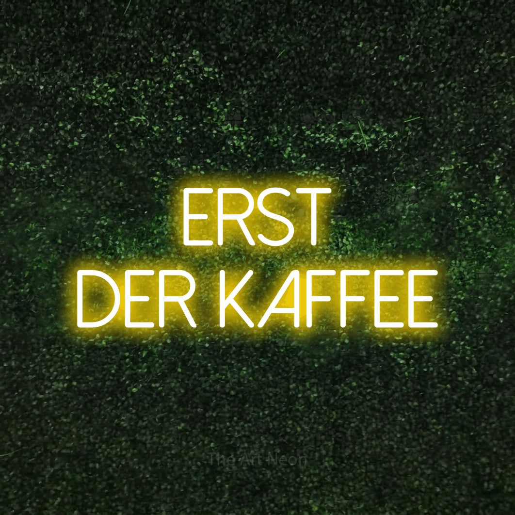 LED neon sign reading “erst der KAFFEE”, arranged in 2 lines.