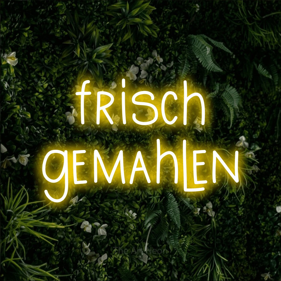 LED neon sign reading “frisch gemahlen”, arranged in 2 lines.