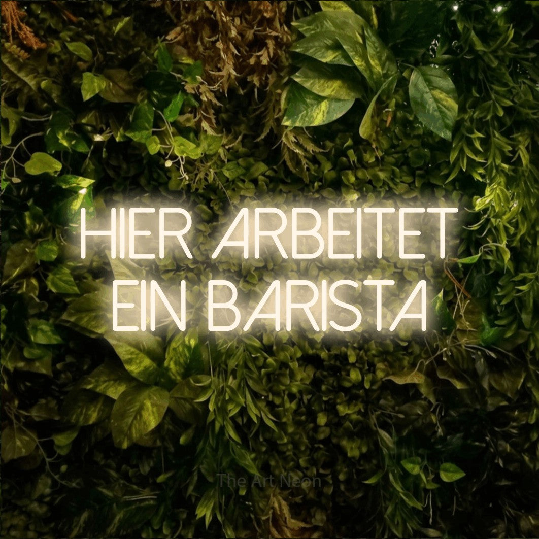LED neon sign reading “Hier arbeitet ein Barista”, arranged in 2 lines.