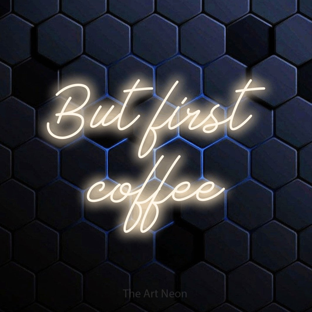 LED neon sign reading “But first coffee”, arranged in 2 lines.