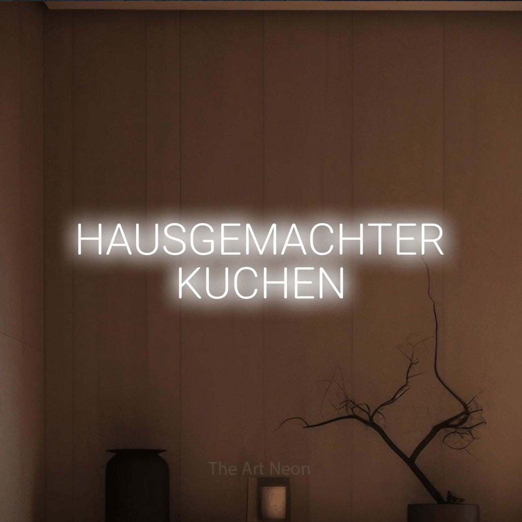 LED neon sign reading “HAUSGEMACHTER KUCHEN”, arranged in 2 lines.