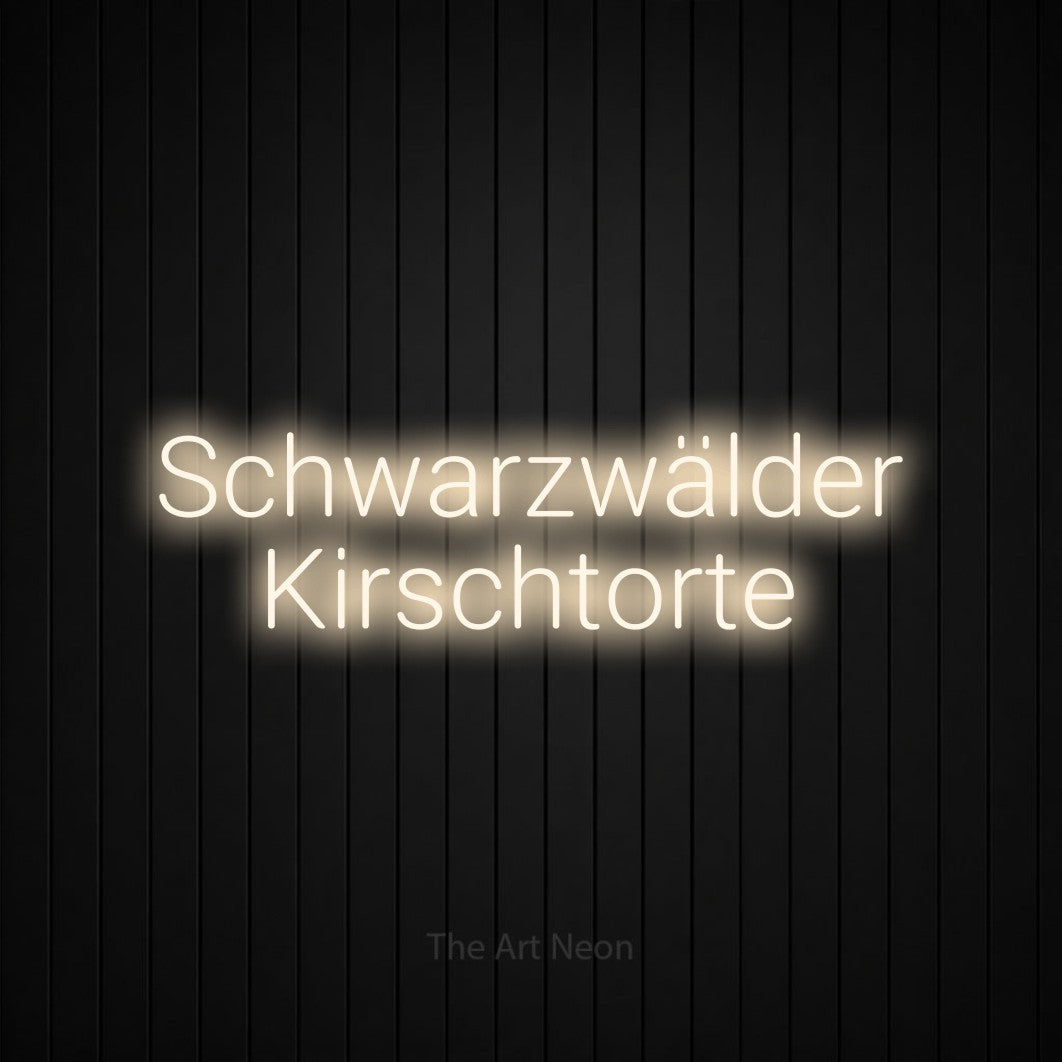 LED neon sign reading “Schwarzwälder Kirschtorte”, arranged in 2 lines.