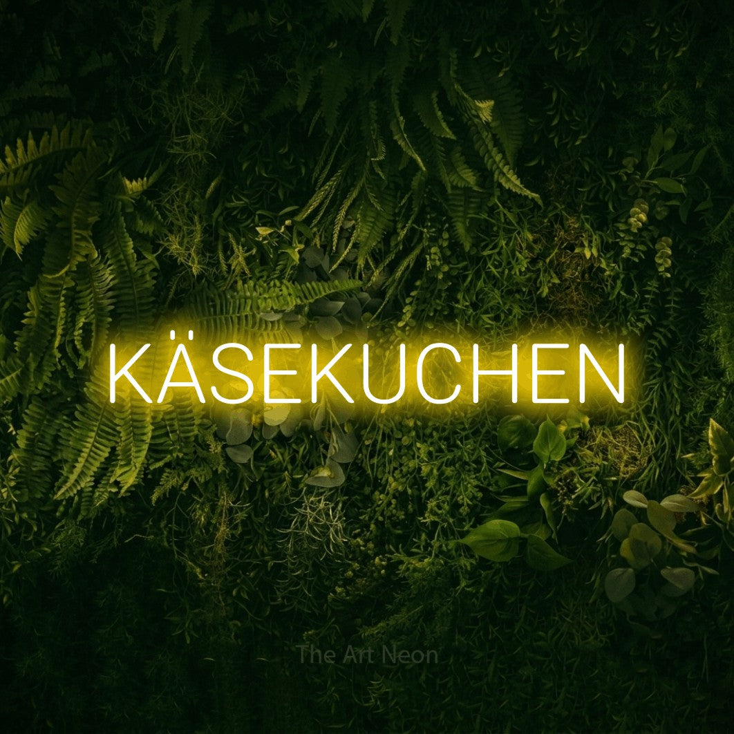 LED neon sign reading “KÄSEKUCHEN”, arranged in a single line.