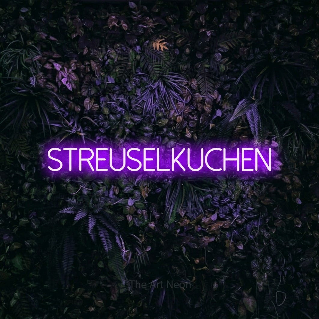 LED neon sign reading “streuselkuchen”, arranged in a single line.