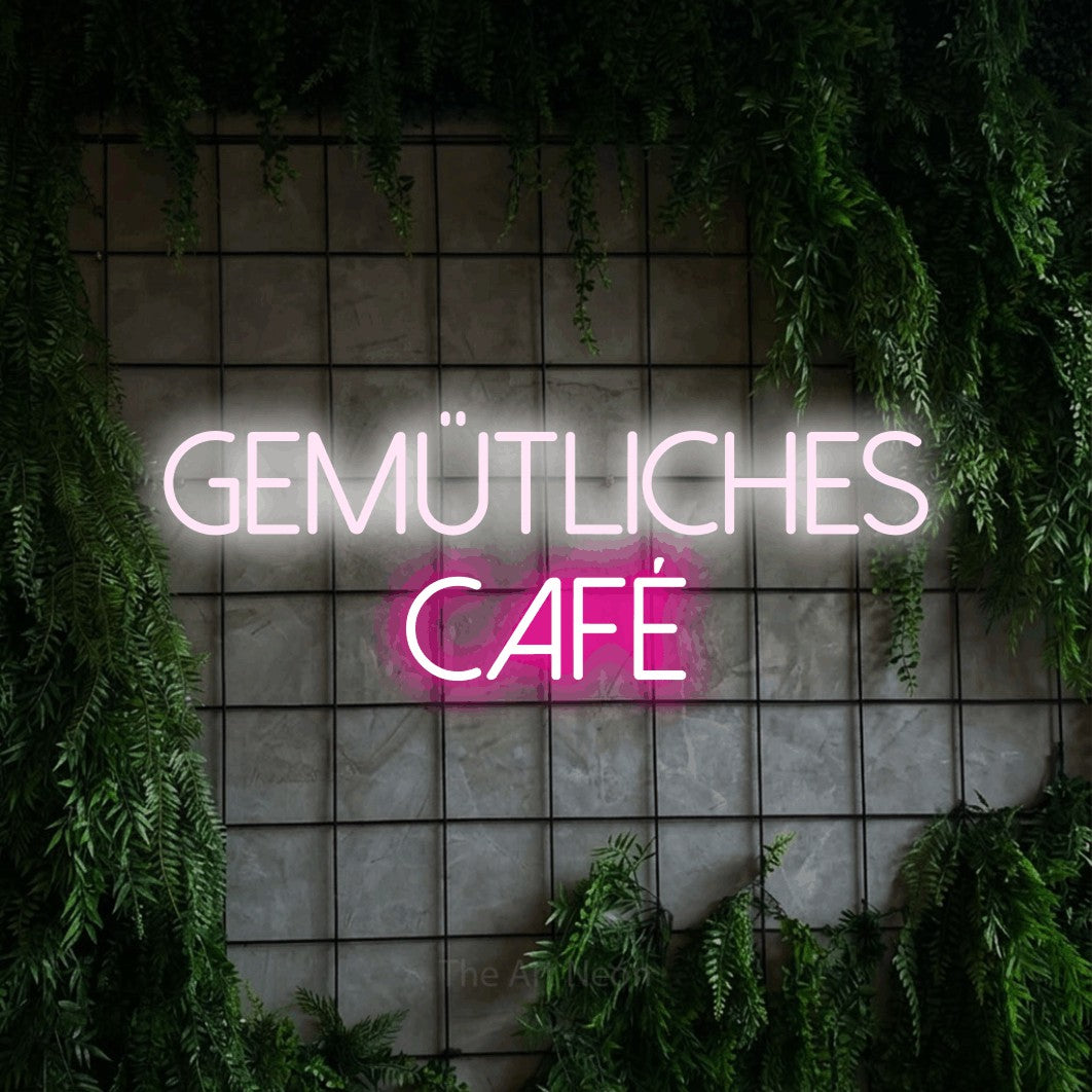 LED neon sign reading “gemütliches café”, arranged in 2 lines.