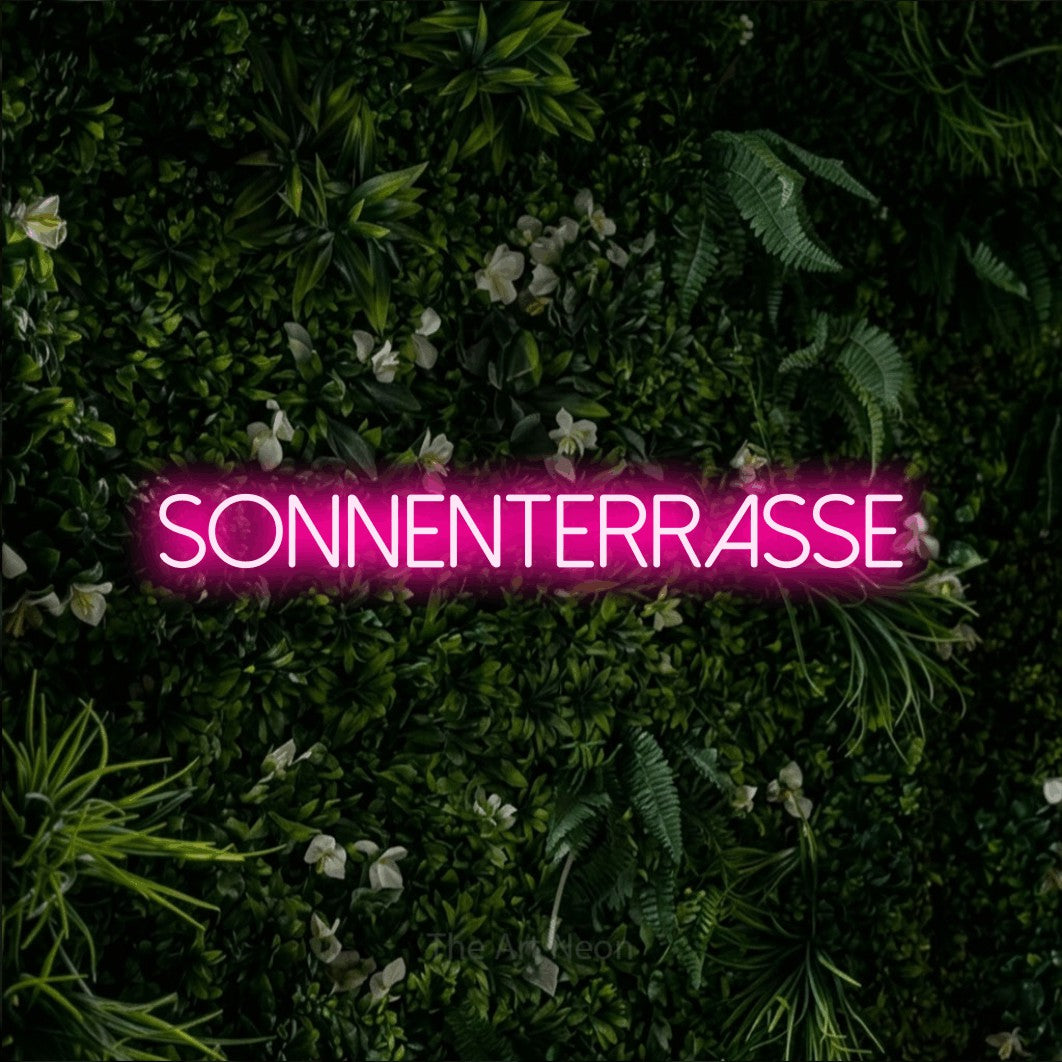 LED neon sign reading “sonnenterrasse”, arranged in a single line.