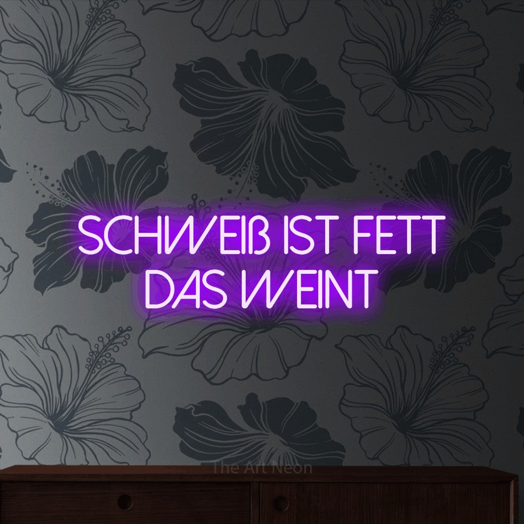 LED neon sign reading “Schweiß ist Fett das weint”, arranged in 2 lines.