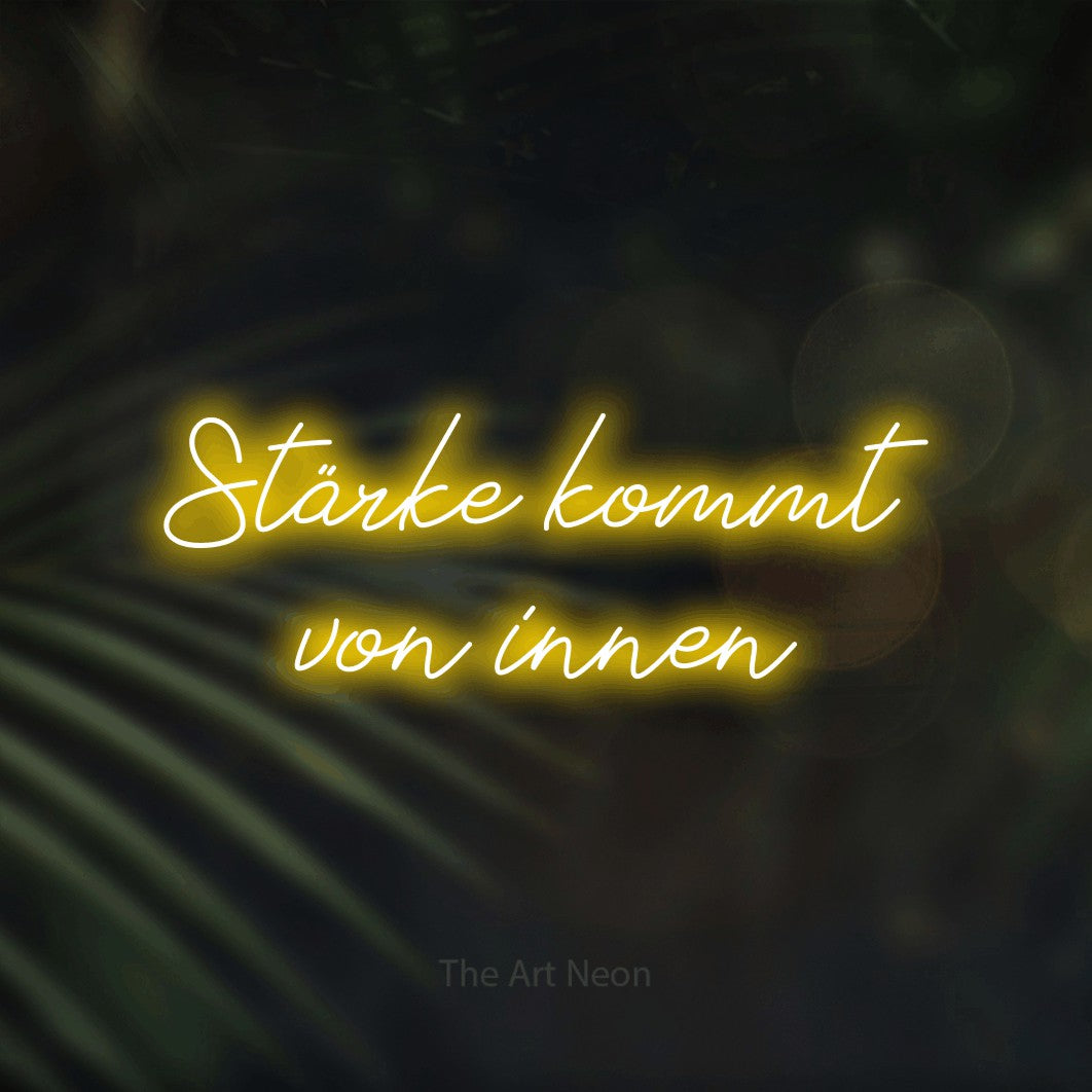 LED neon sign reading “Stärke kommt von innen”, arranged in 2 lines.
