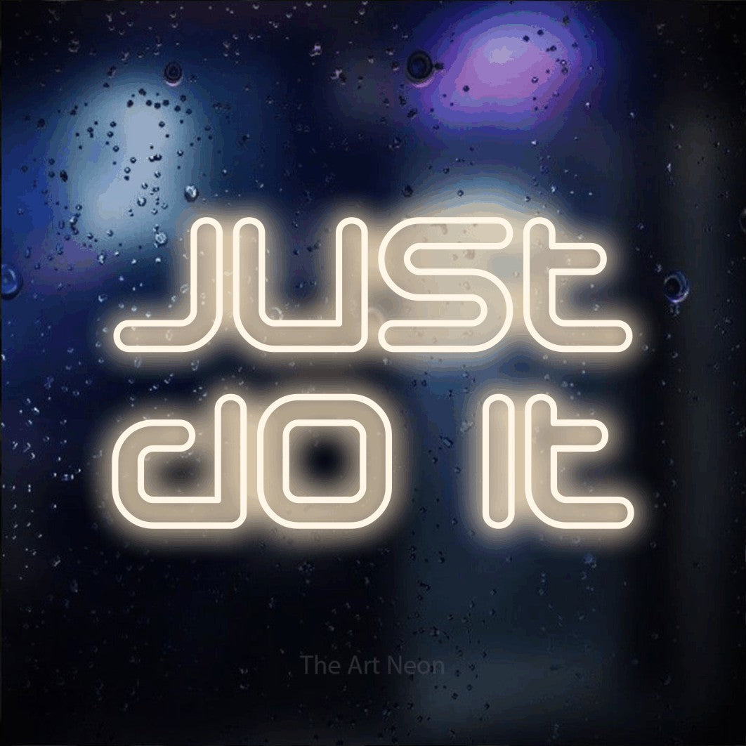LED neon sign reading “just do it”, arranged in 2 lines.
