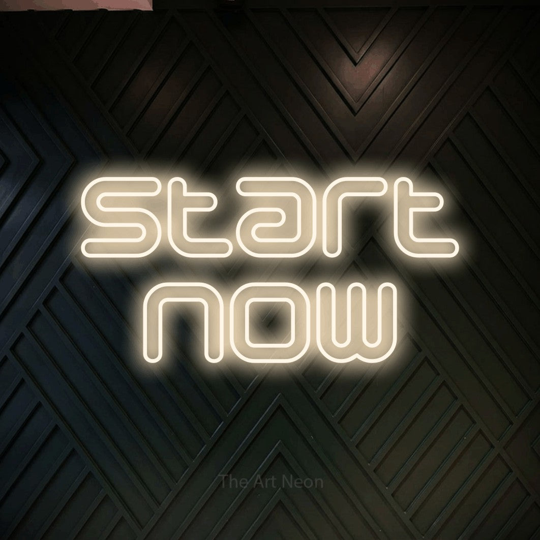 LED neon sign reading “start now”, arranged in 2 lines.