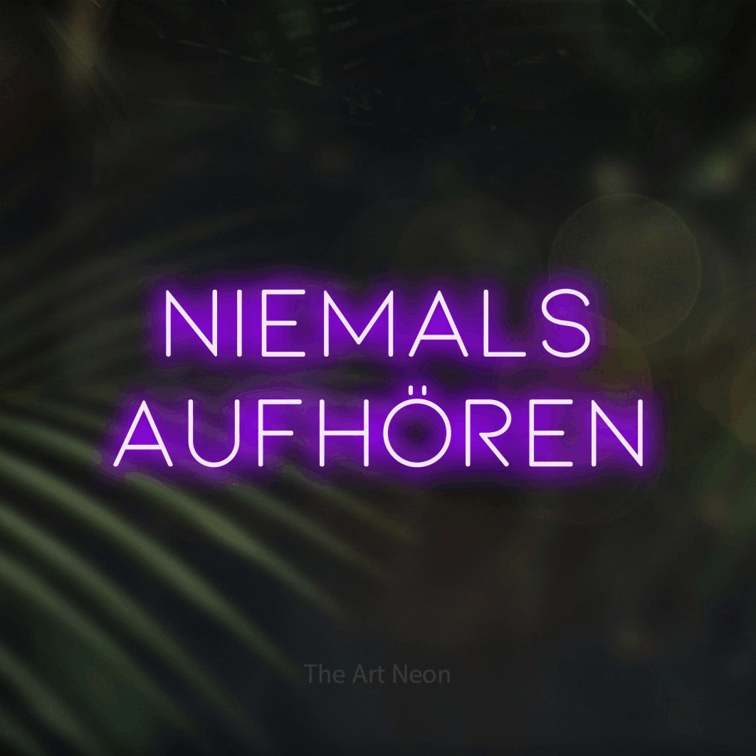 LED neon sign reading “niemals aufhören”, arranged in 2 lines.