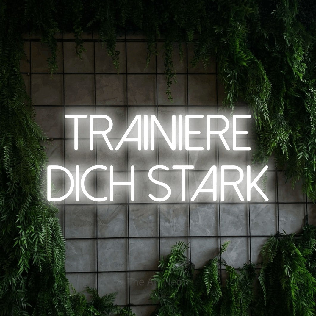 LED neon sign reading “Trainiere dich stark”, arranged in 2 lines.