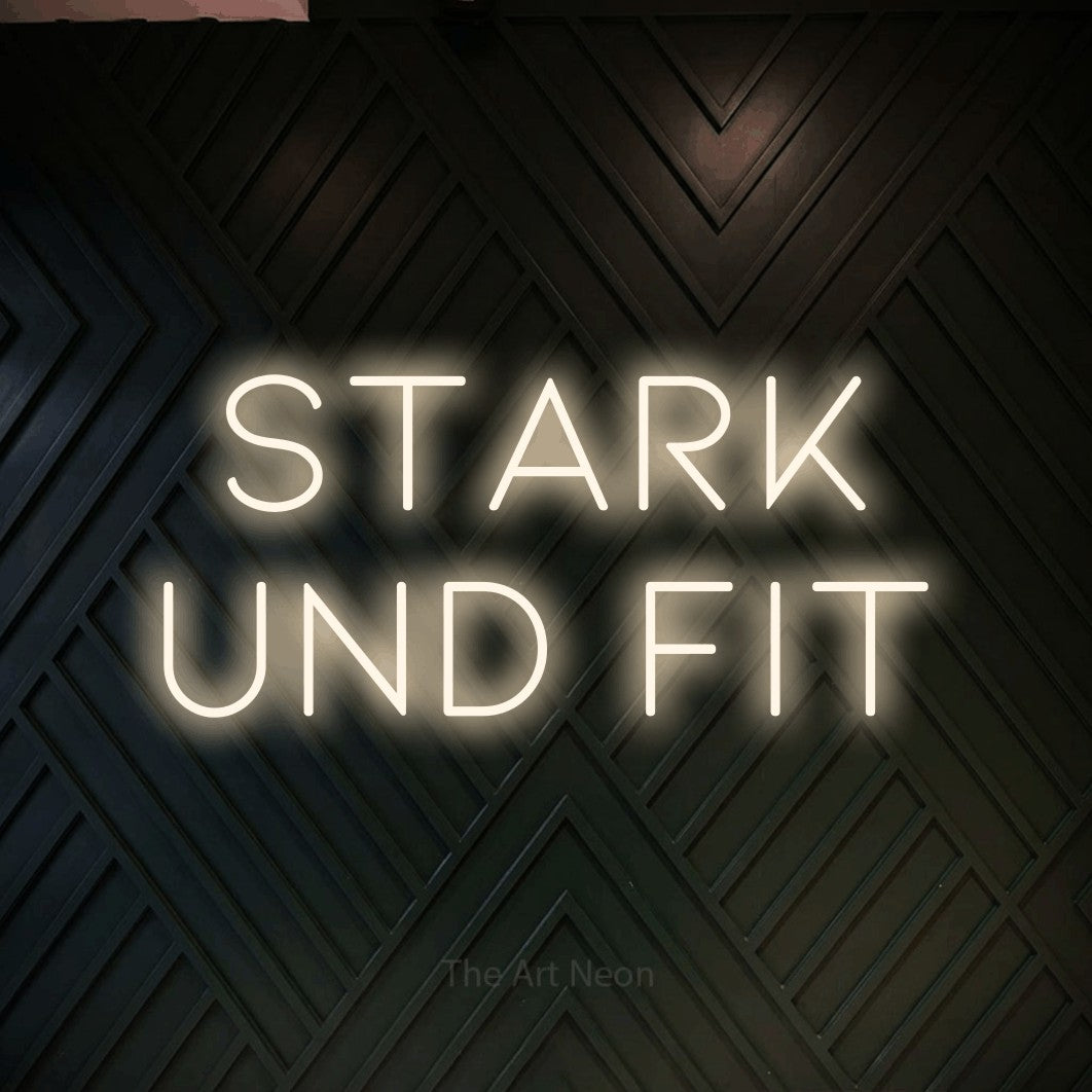 LED neon sign reading “Stark und fit”, arranged in 2 lines.