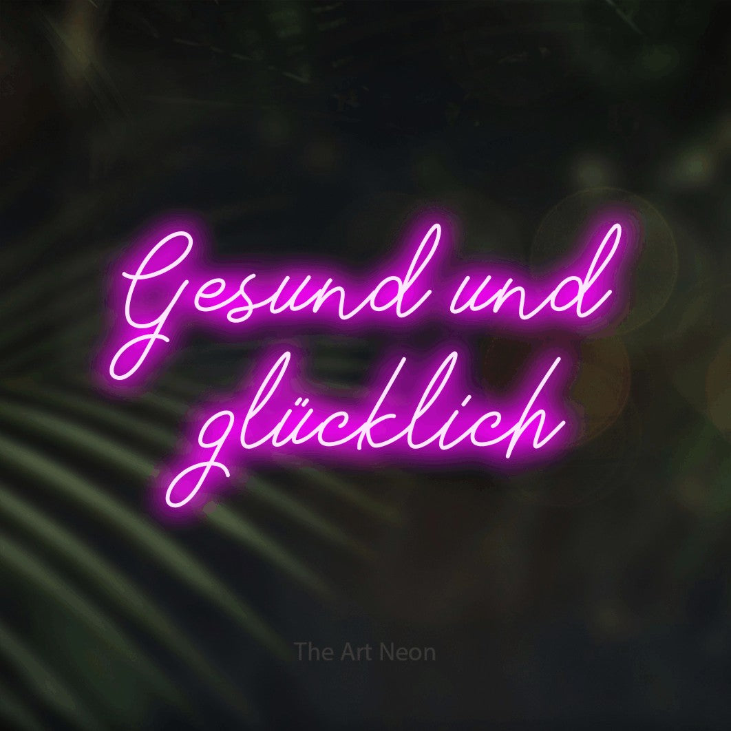 LED neon sign reading “Gesund und glücklich”, arranged in 2 lines.