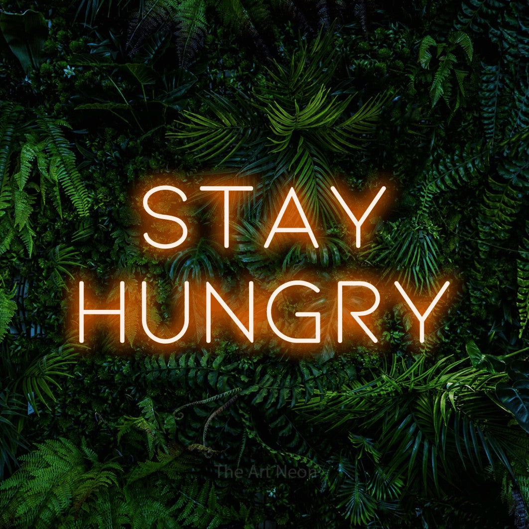 LED neon sign reading “stay hungry”, arranged in 2 lines.