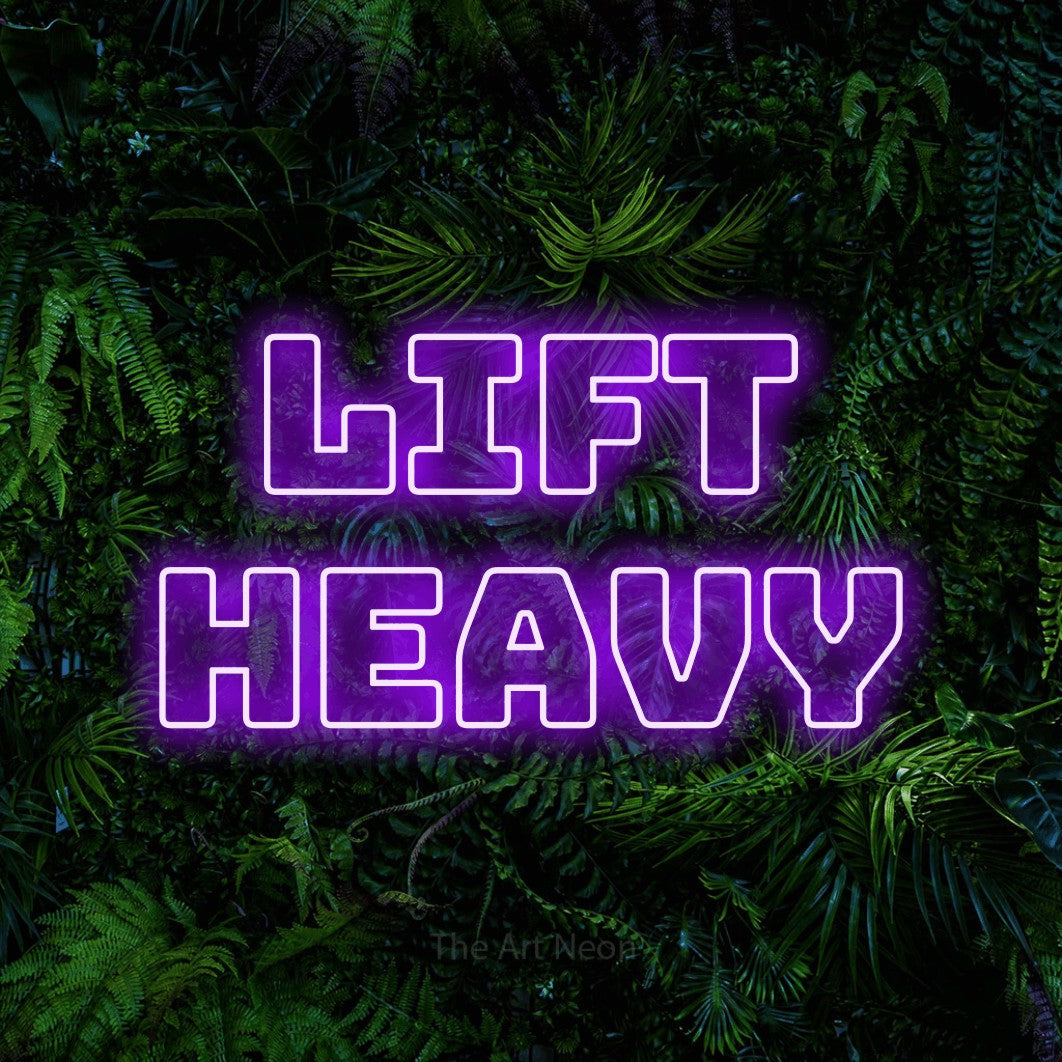 LED neon sign reading “Lift heavy”, arranged in 2 lines.