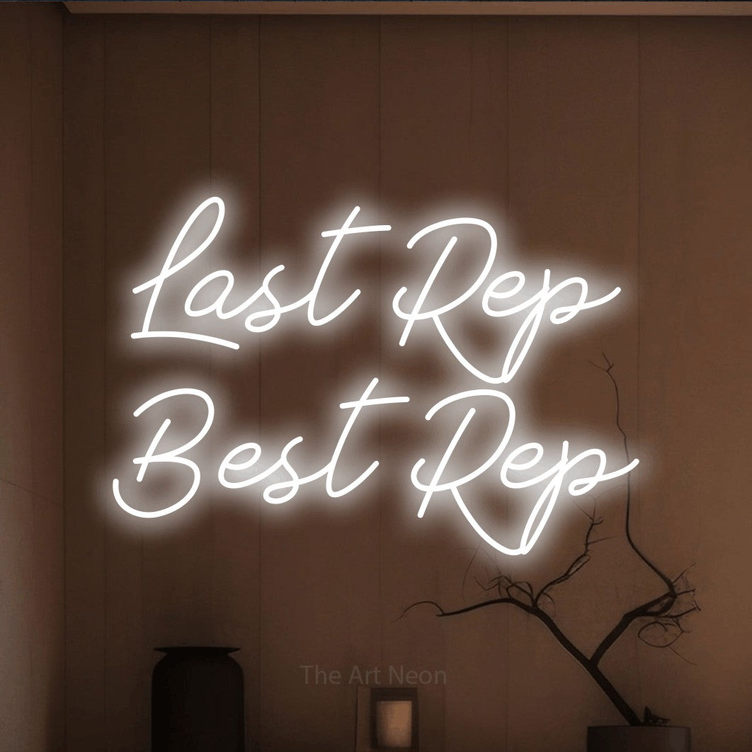 LED neon sign displaying “Last Rep Best Rep”.