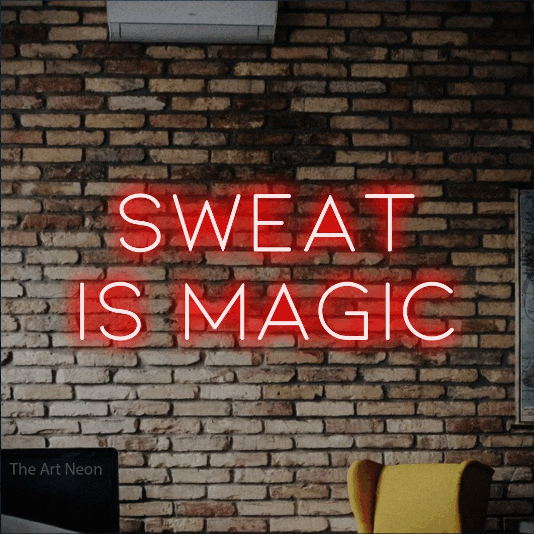 LED neon sign reading “SWEAT is magic”, arranged in 2 lines.