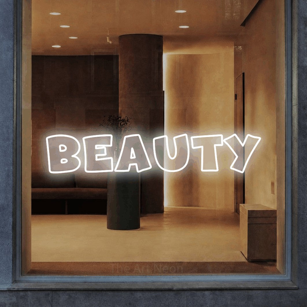 LED neon sign reading “BEAUTY”, arranged in a single line.