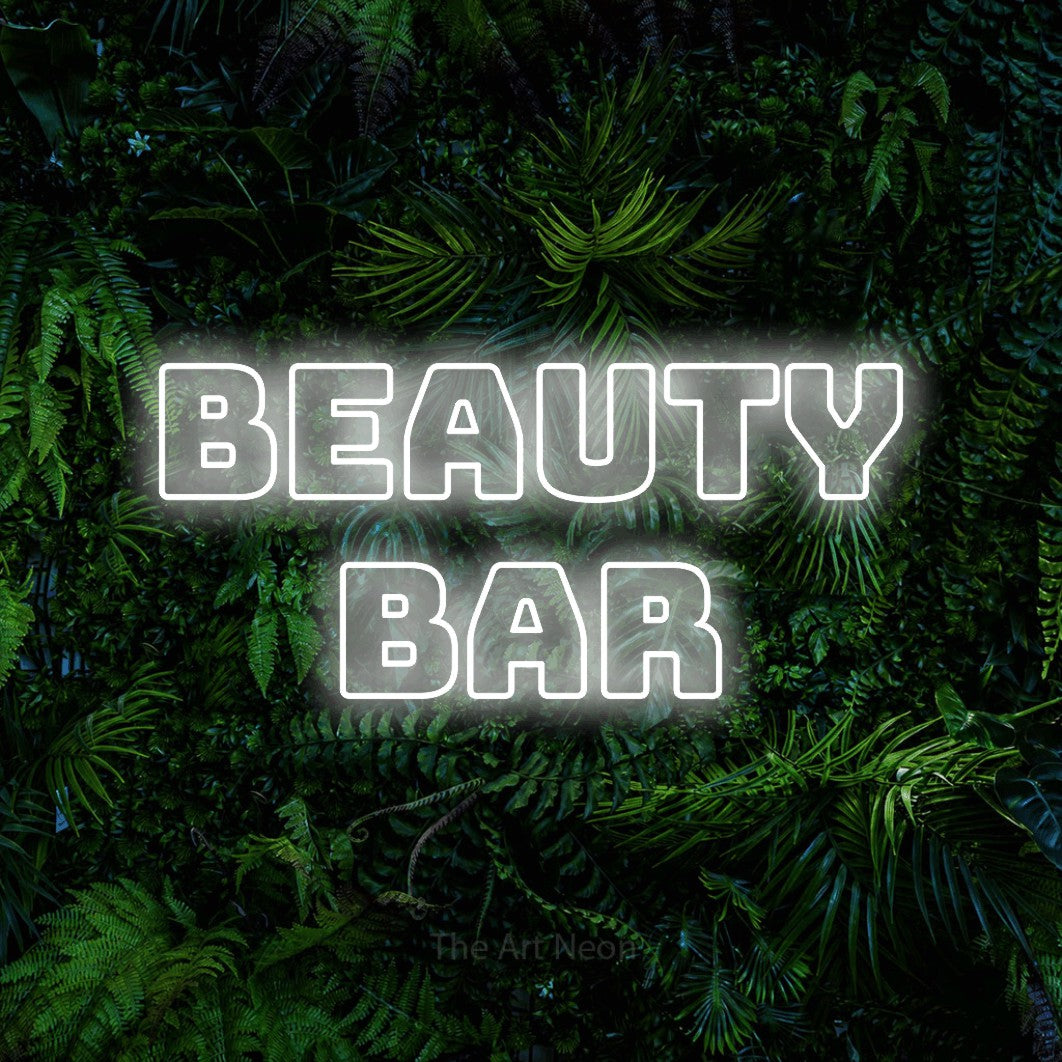 LED neon sign reading “beauty bar”, arranged in 2 lines.