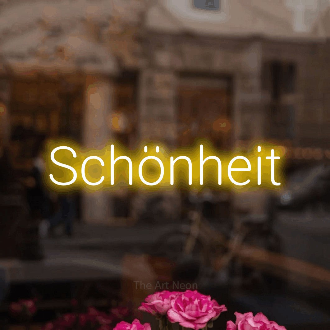 LED neon sign reading “Schönheit”, arranged in a single line.