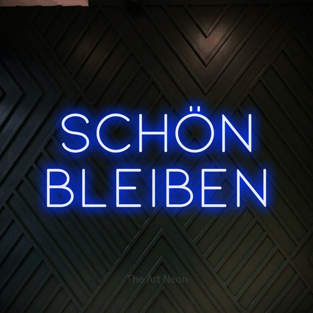 LED neon sign reading “SCHÖN BLEIBEN”, arranged in 2 lines.