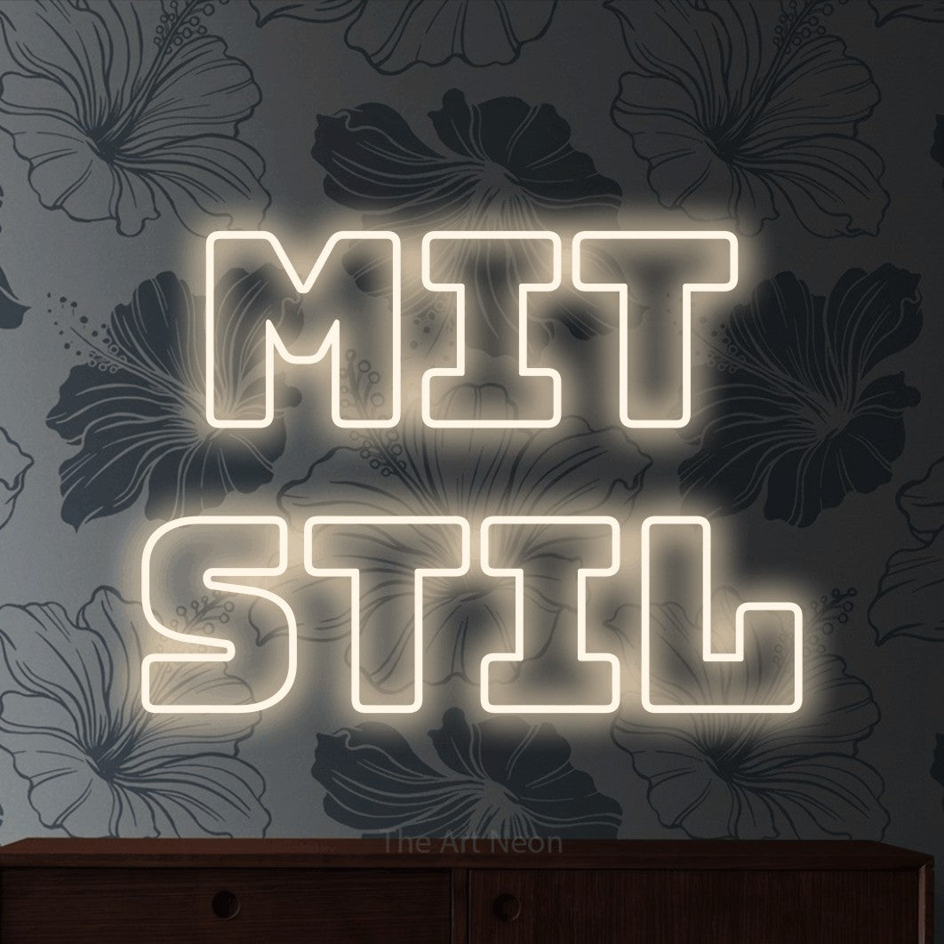 LED neon sign reading “mit stil”, arranged in 2 lines.