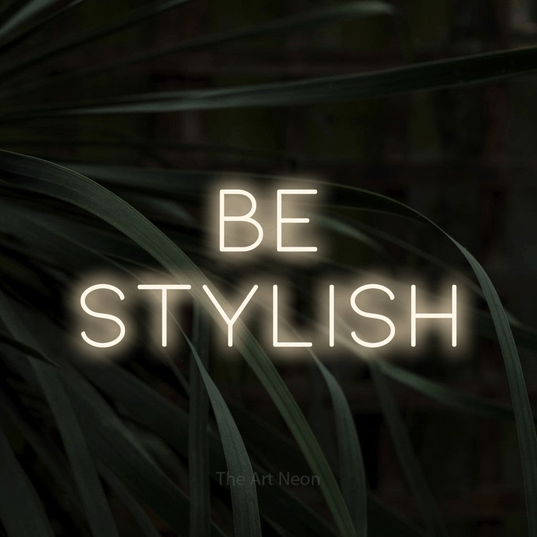 LED neon sign reading “be stylish”, arranged in 2 lines.