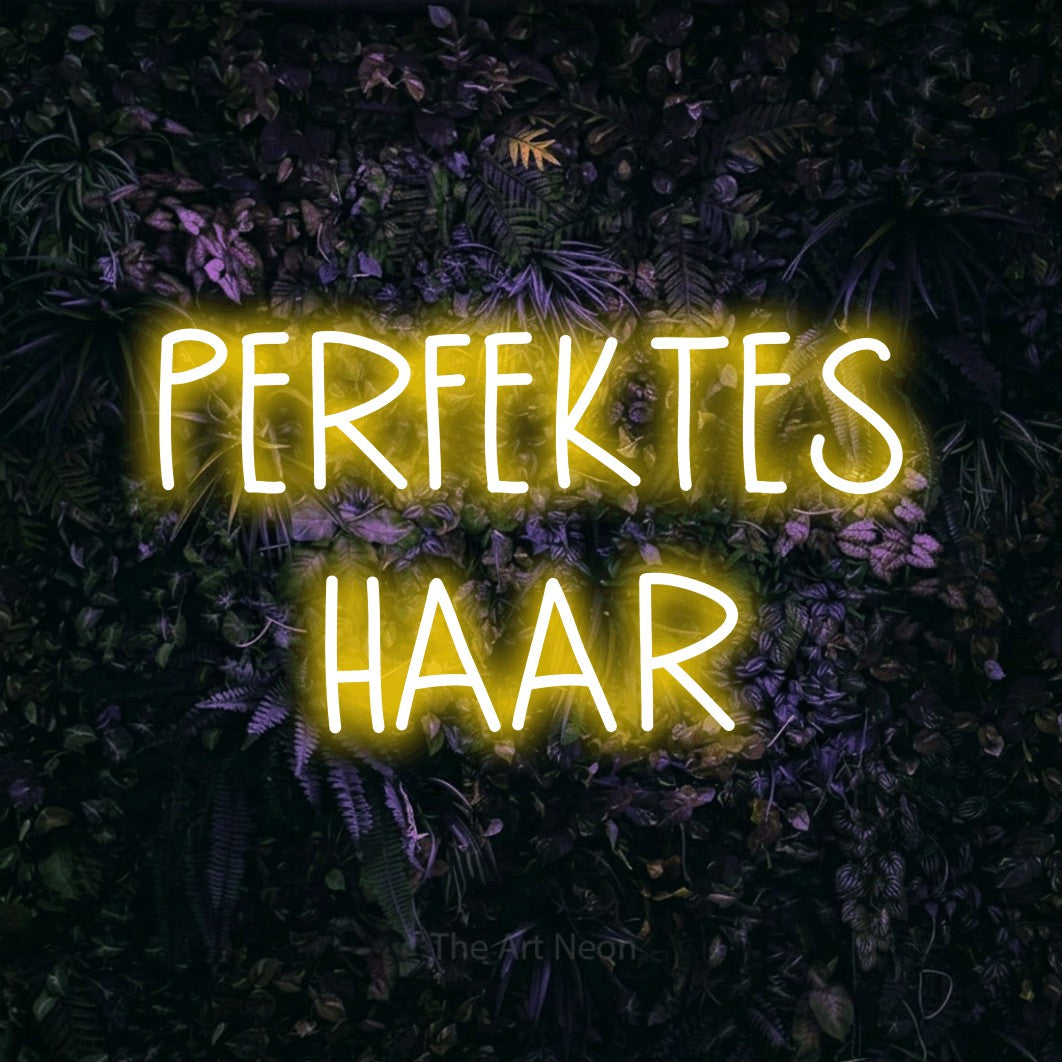 LED neon sign reading “PERFEKTES HAAR”, arranged in 2 lines.