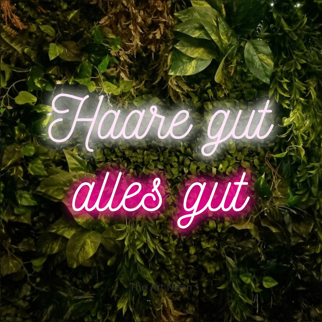 LED neon sign reading “Haare gut alles gut”, arranged in 2 lines.