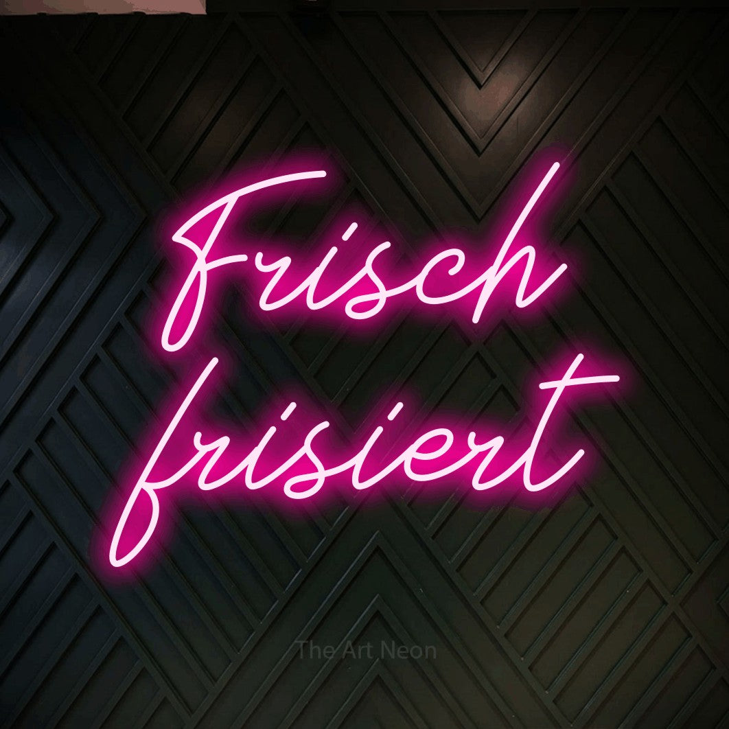 LED neon sign reading “Frisch frisiert”, arranged in 2 lines.