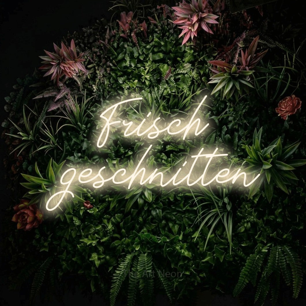 LED neon sign reading “Frisch geschnitten”, arranged in 2 lines.