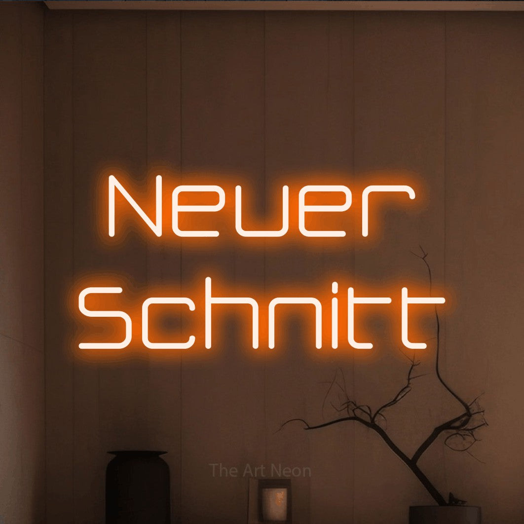 LED neon sign reading “Neuer Schnitt”, arranged in 2 lines.