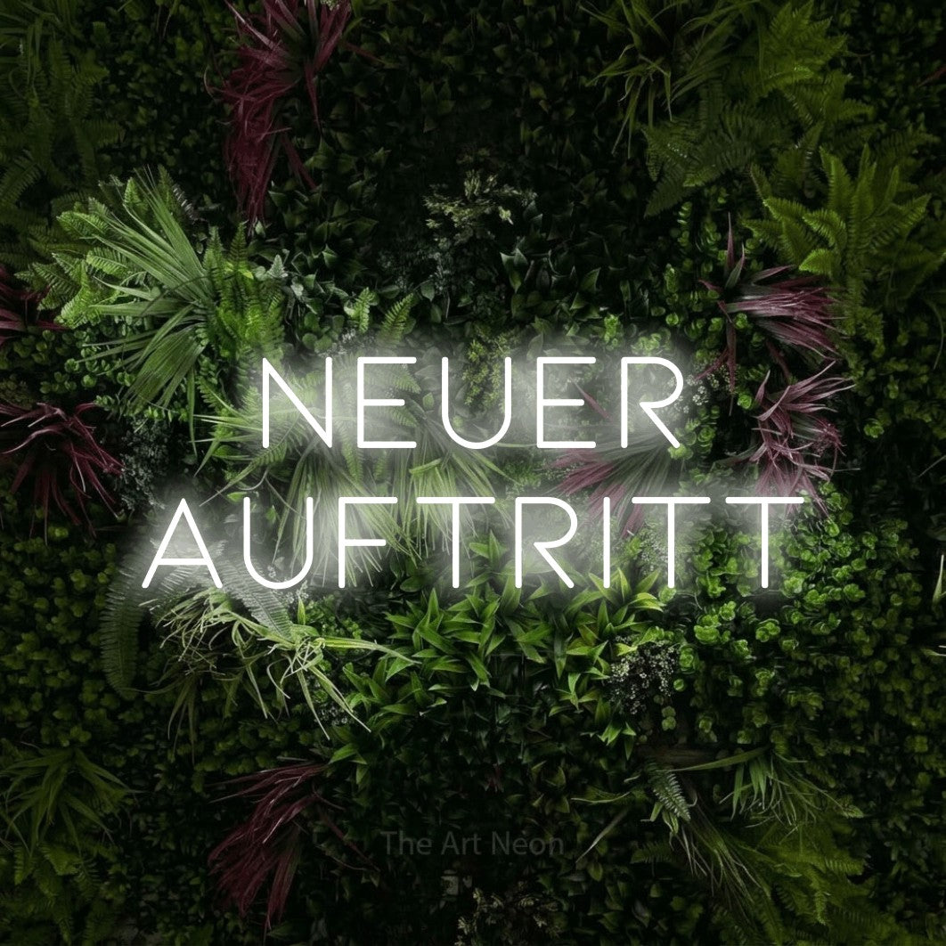 LED neon sign reading “Neuer Auftritt”, arranged in 2 lines.
