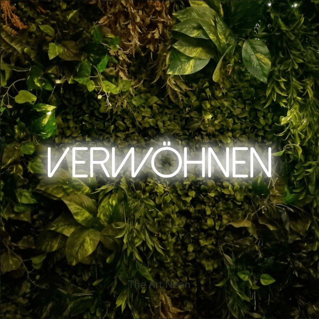 LED neon sign reading “Verwöhnen”, arranged in a single line.