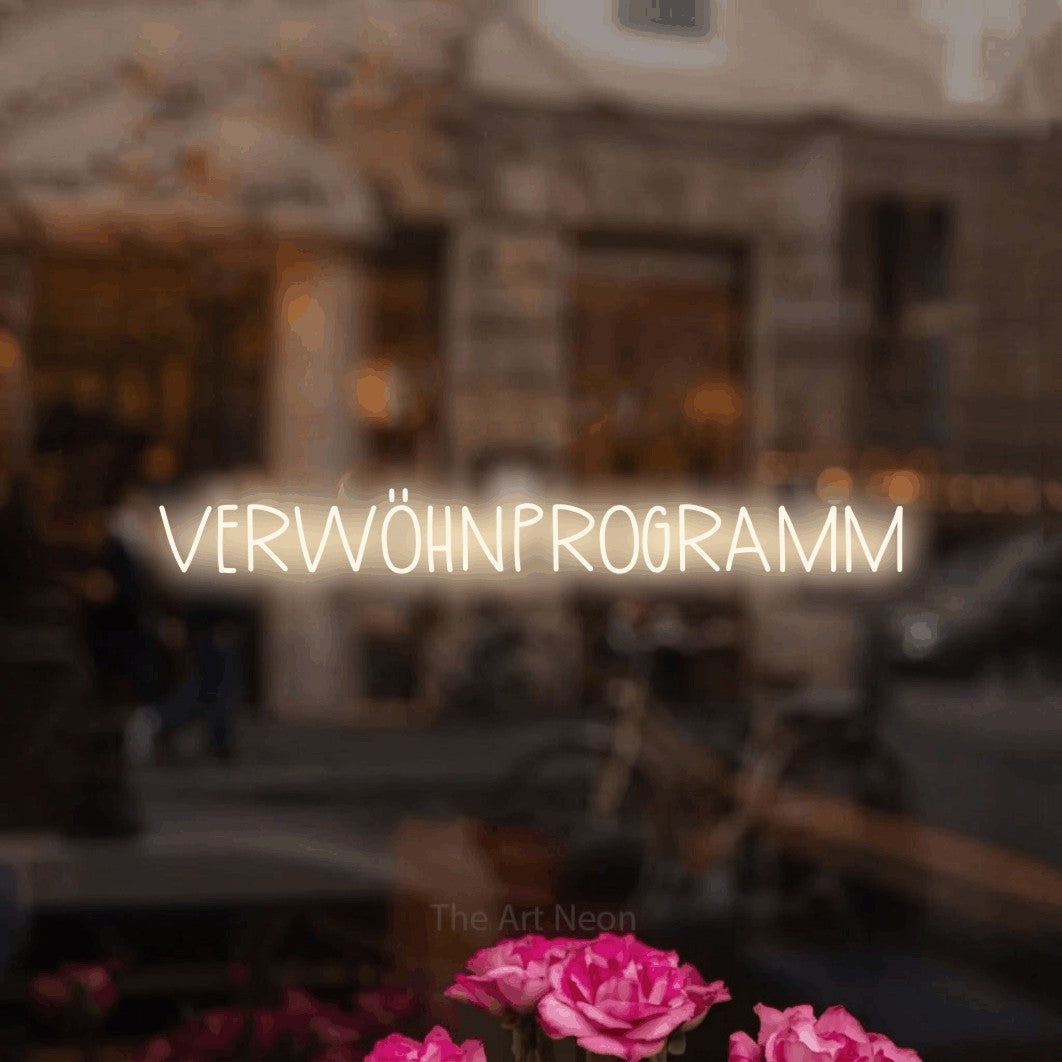 LED neon sign reading “VERWÖHNPROGRAMM”, arranged in a single line.