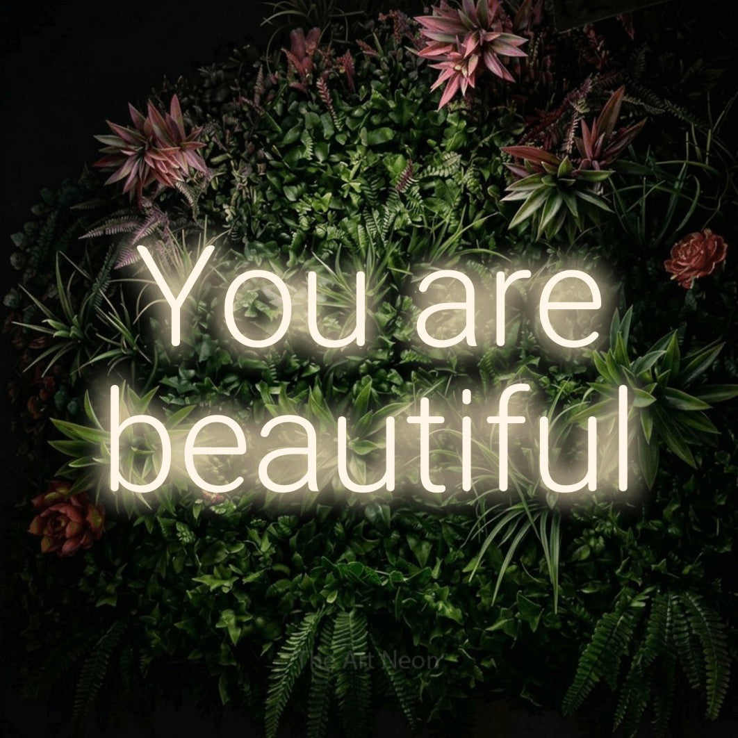 LED neon sign reading “You are beautiful”, arranged in 2 lines.
