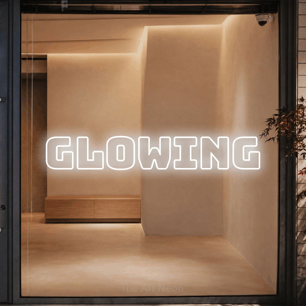 LED neon sign reading “GLOWING”, arranged in a single line.