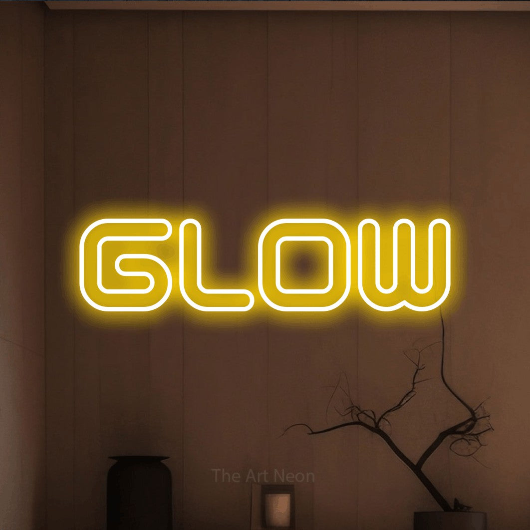 LED neon sign reading “Glow”, arranged in a single line.