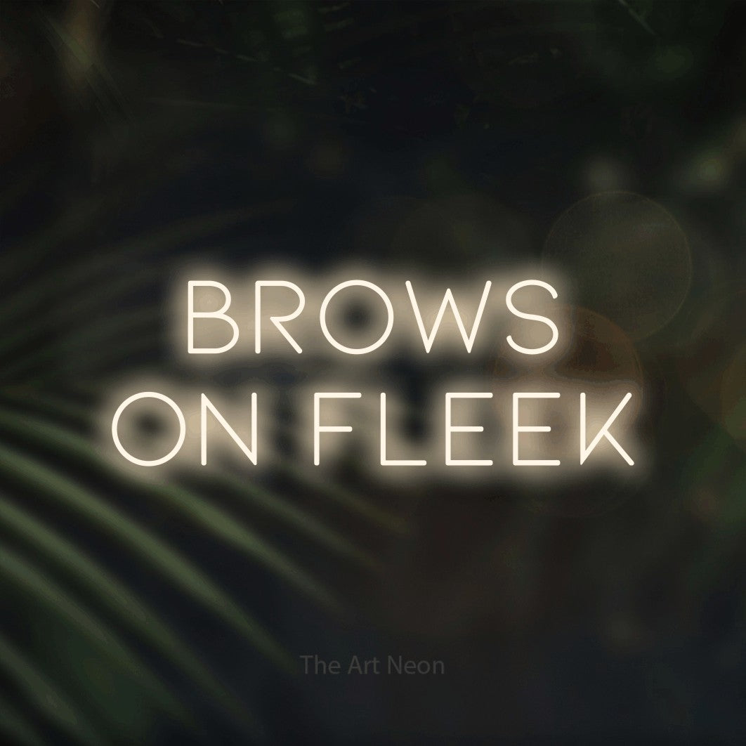 LED neon sign reading “Brows on fleek”, arranged in 2 lines.