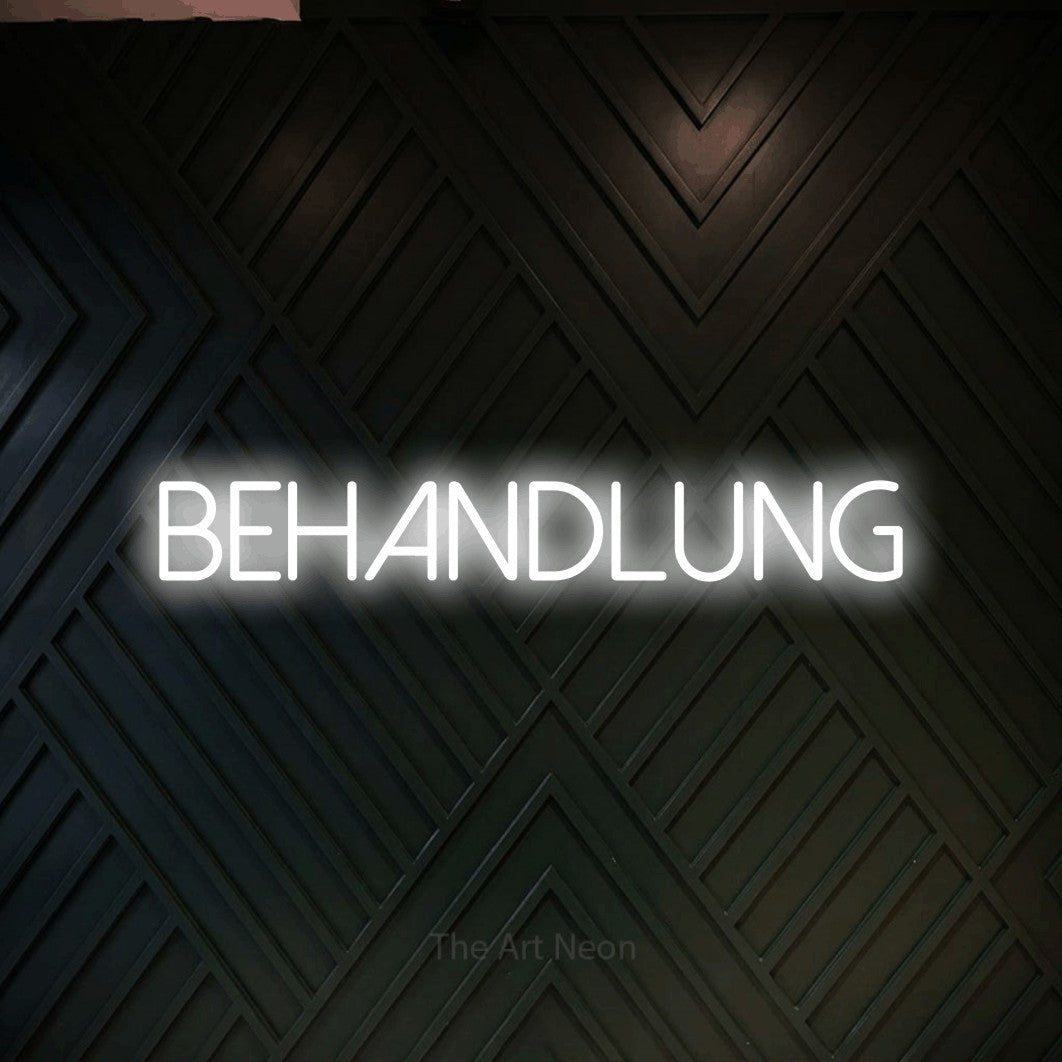 LED neon sign reading “BEHANDLUNG”, arranged in a single line.