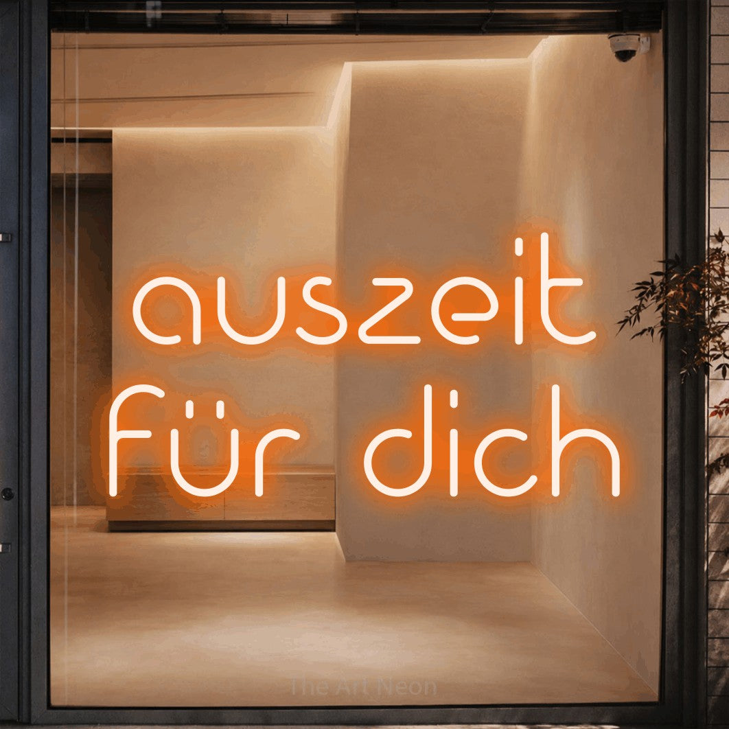 LED neon sign reading “auszeit für dich”, arranged in 2 lines.
