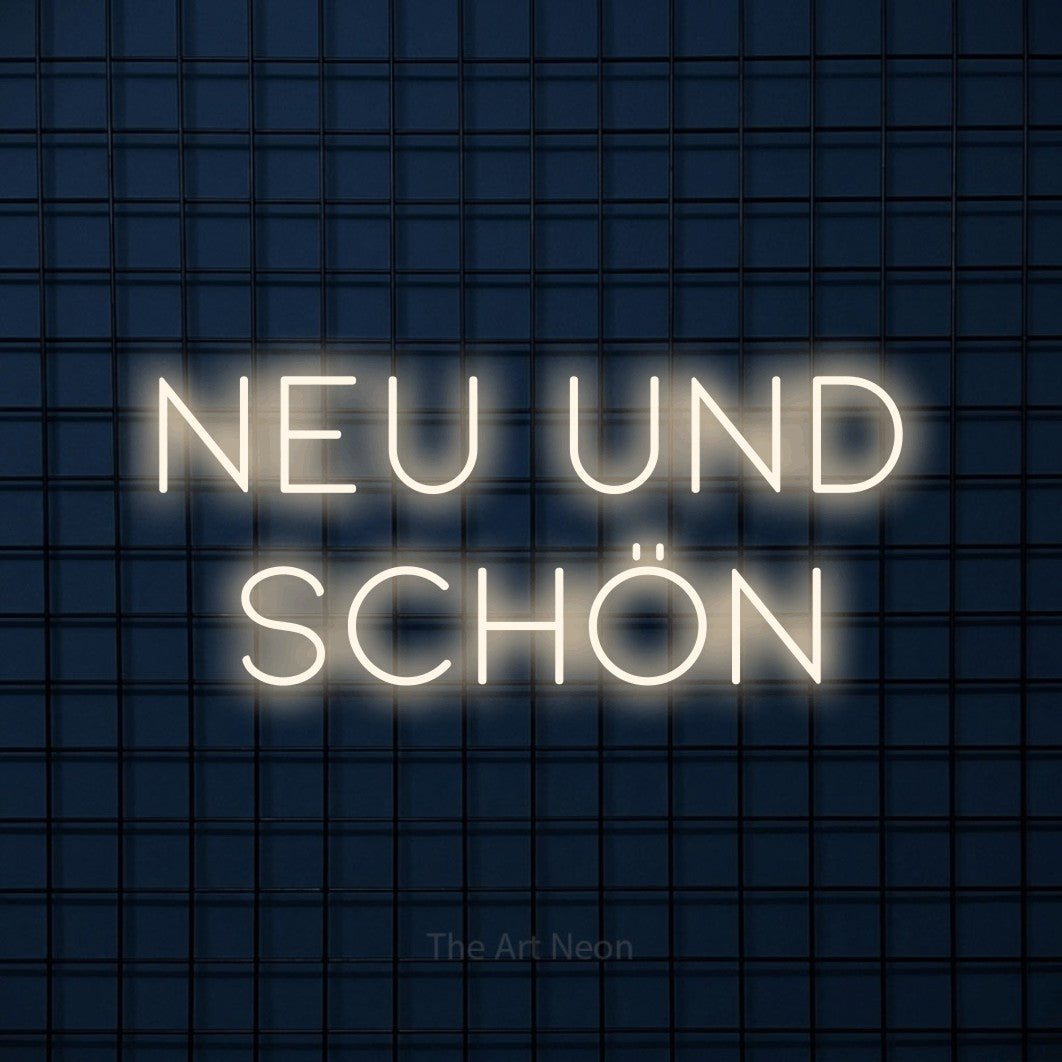 LED neon sign reading “Neu und schön”, arranged in 2 lines.