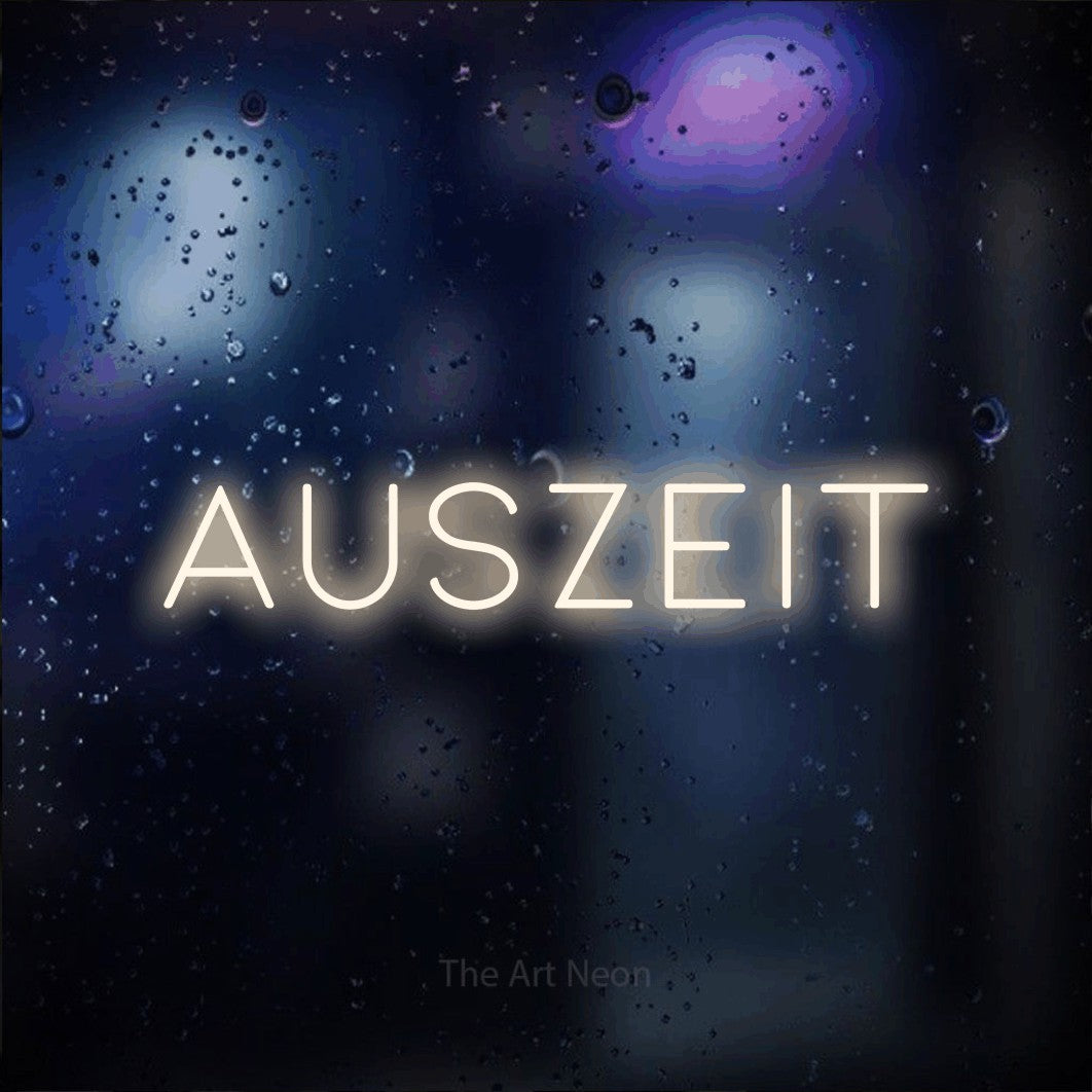 LED neon sign reading “auszeit”, arranged in a single line.